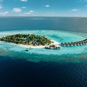 Aerial of Nova Maldives, small natural island with greenery and expansive lagoon