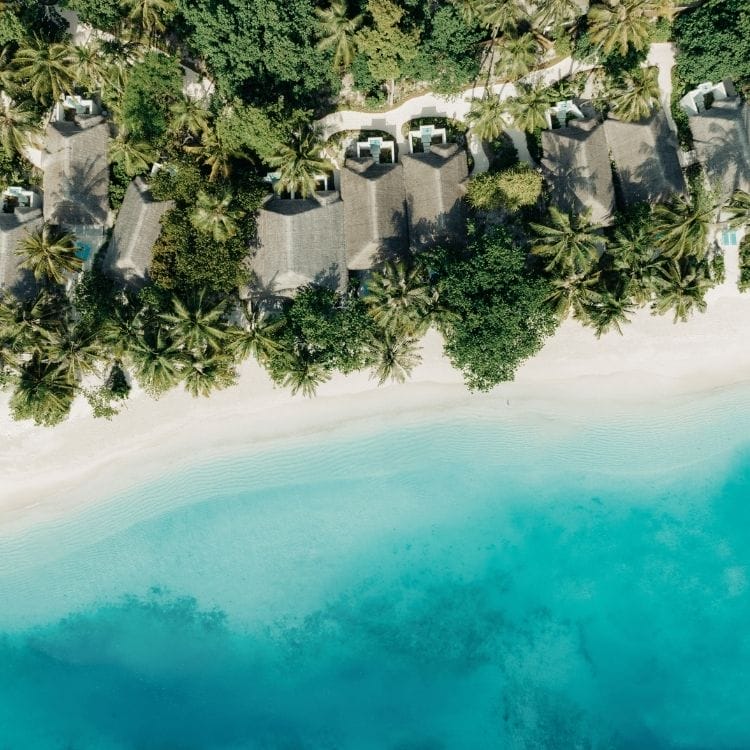 Aerial of the beach villas and white sandy beaches at Nova Maldives