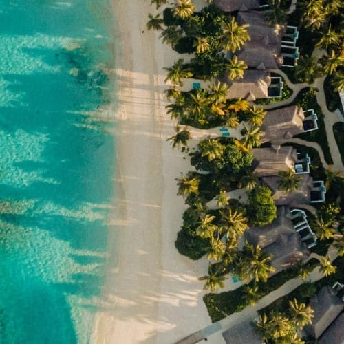 Aerial of the white sandy beaches and and villas at Nova Maldives