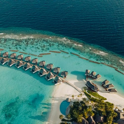 Aerial of Nova Maldives, water villa jetty