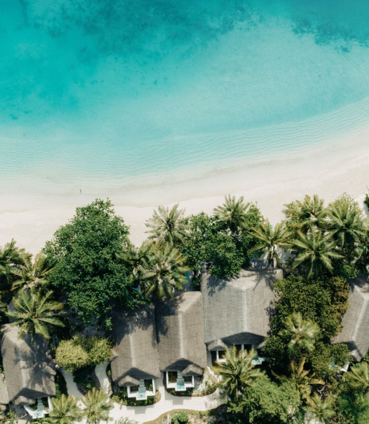 Aerial of the beach villas and white sandy beaches at Nova Maldives