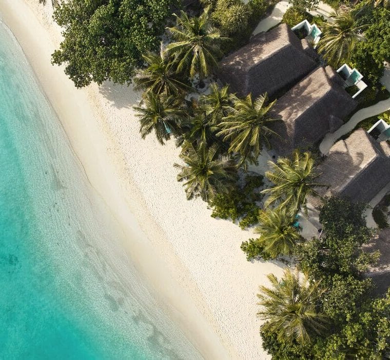 Aerial of the white sandy beaches and and villas at Nova Maldives