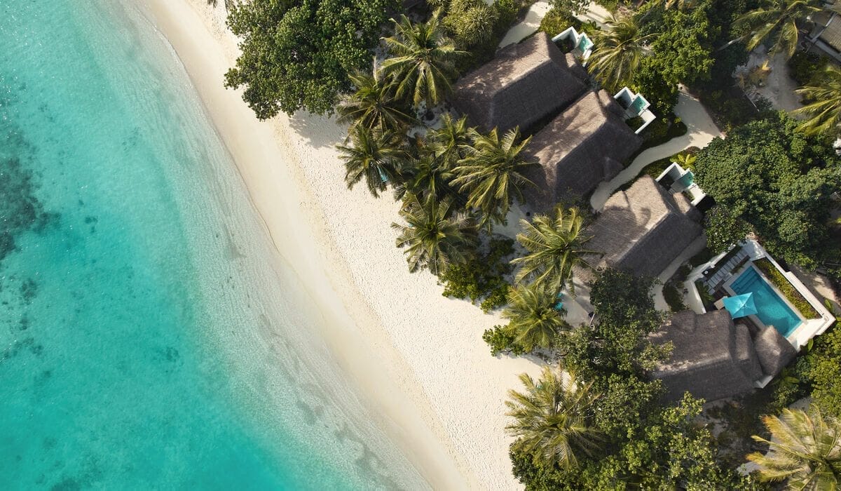 Aerial of the white sandy beaches and and villas at Nova Maldives
