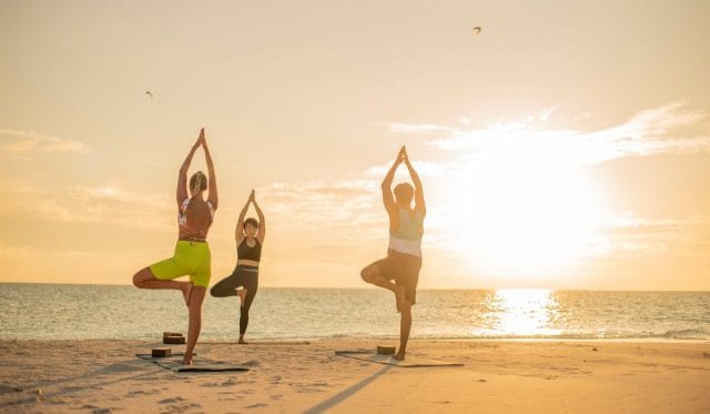 Sunrise yoga at Nova Maldives beach