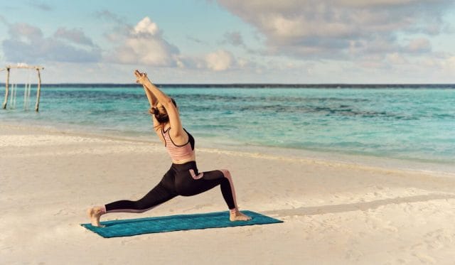 Sunrise yoga at Nova Maldives beach